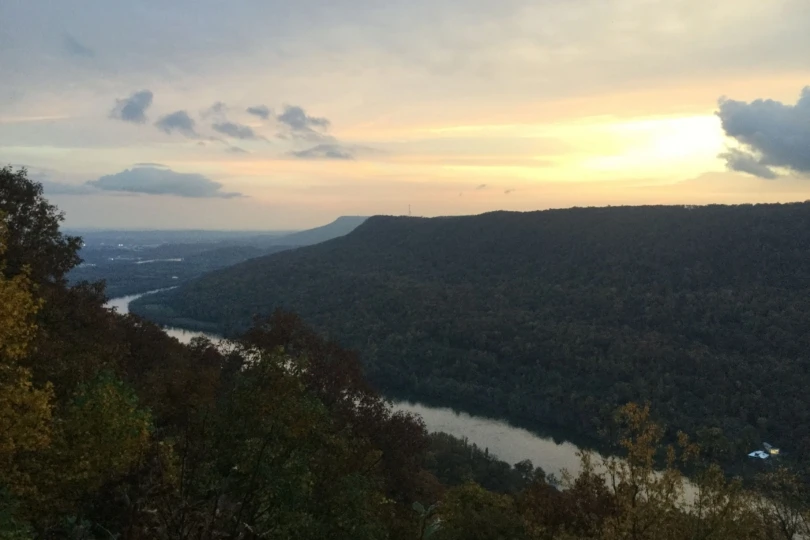 overlook of a river and mountainous forest 