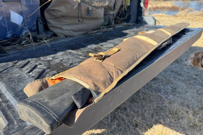 Duck Camp gun sleeve laid open on a truck tailgate