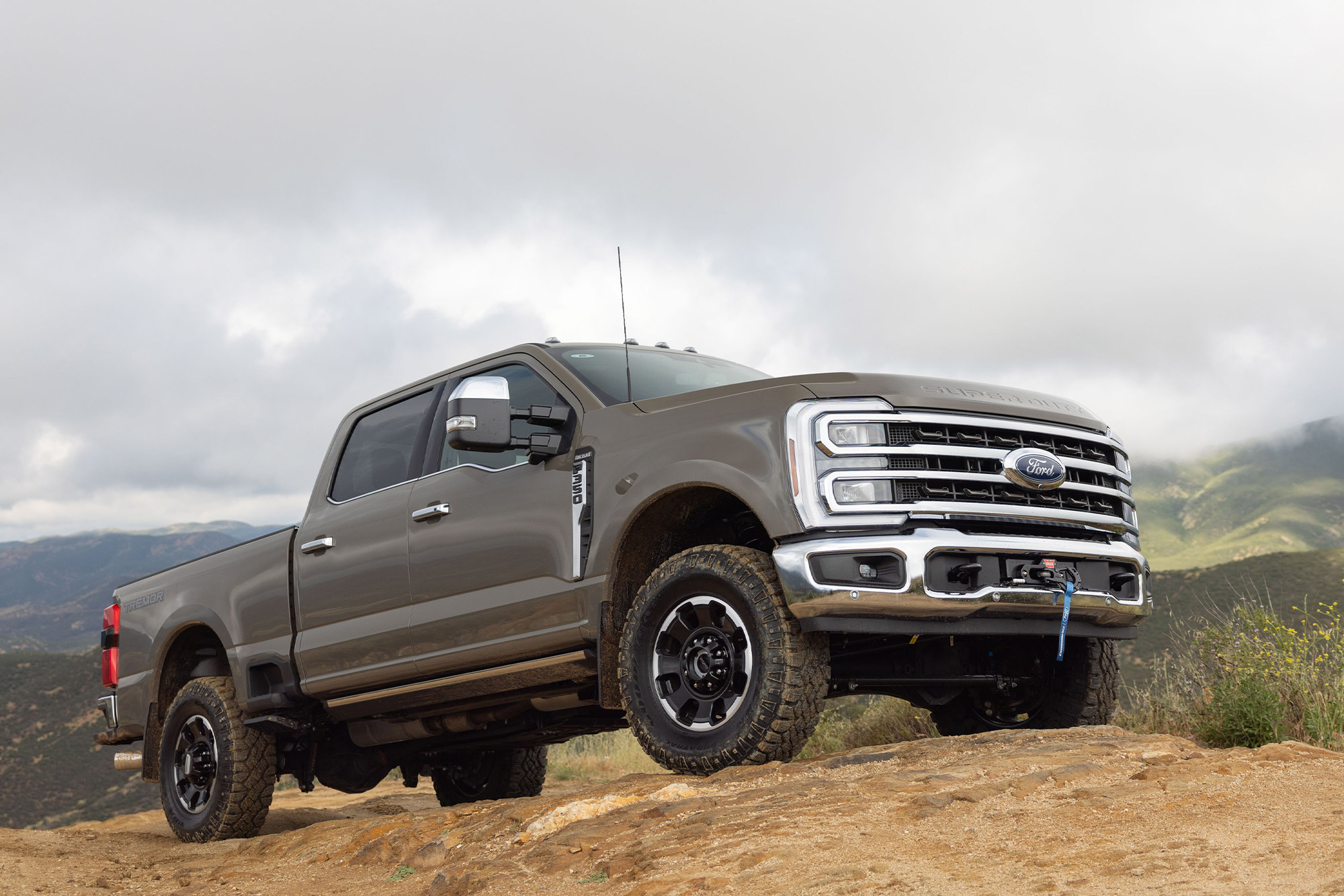 2026 Ford F 350 King Ranch Tremor parked on rocky terrain in the mountains