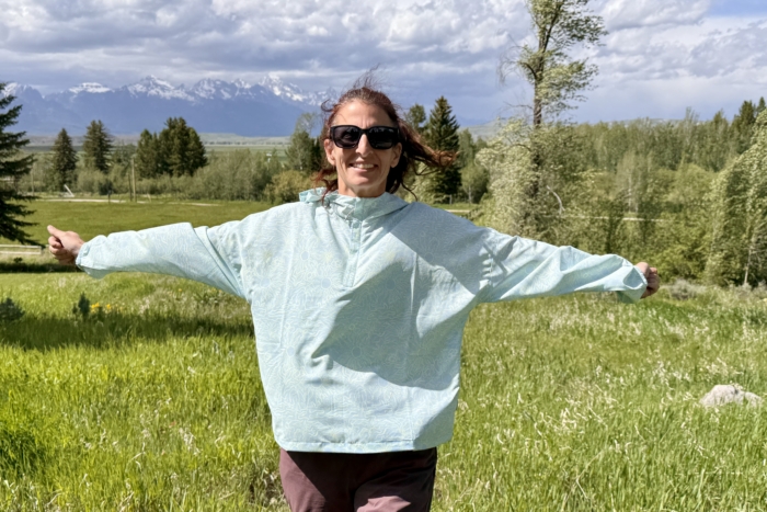 Woman showing the fit of a sun shirt