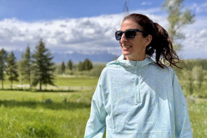 Woman wearing a sun shirt on a hike