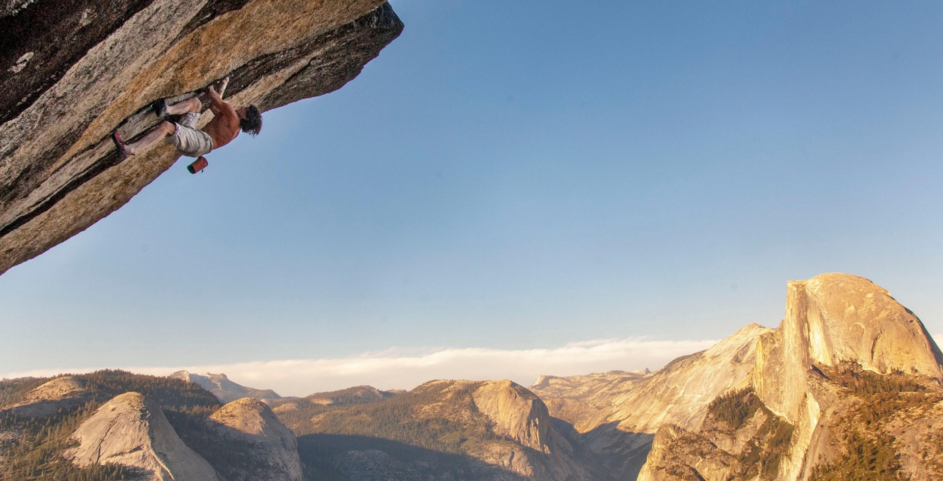 climber goes up overhung route