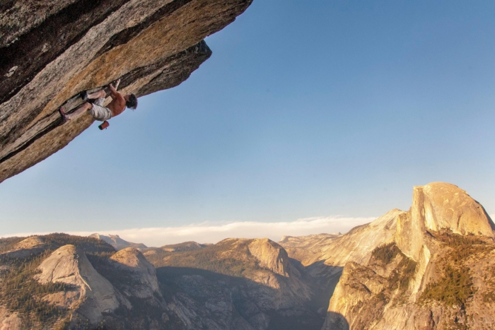 climber goes up overhung route