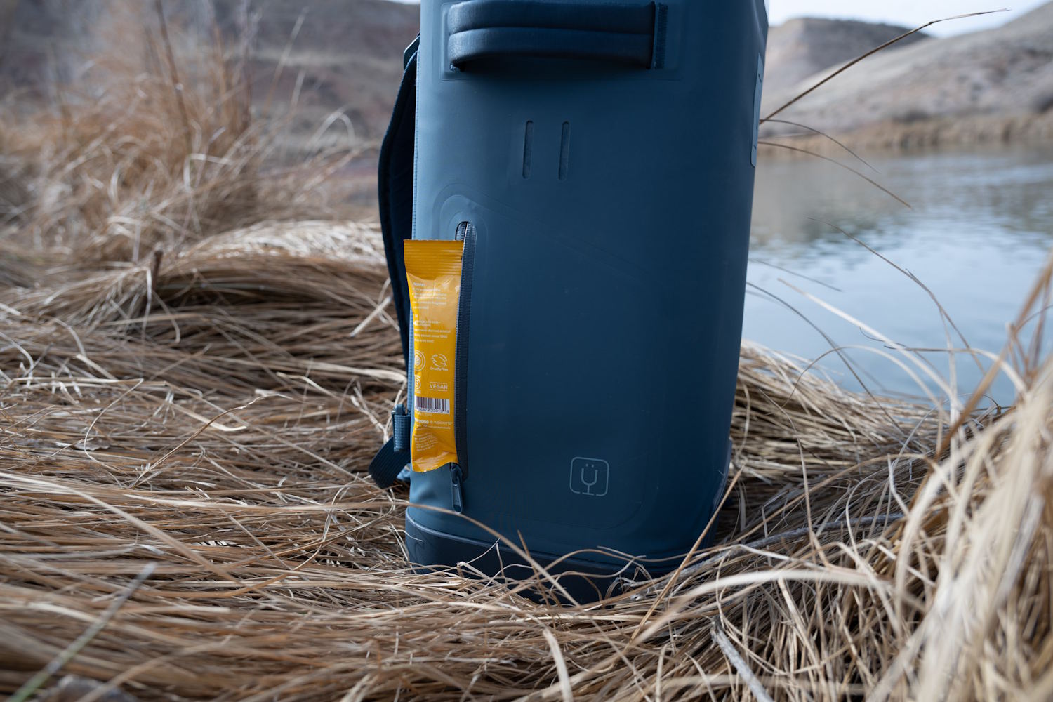 Close-up of a yellow packet tucked into the MagPack's side zipper.