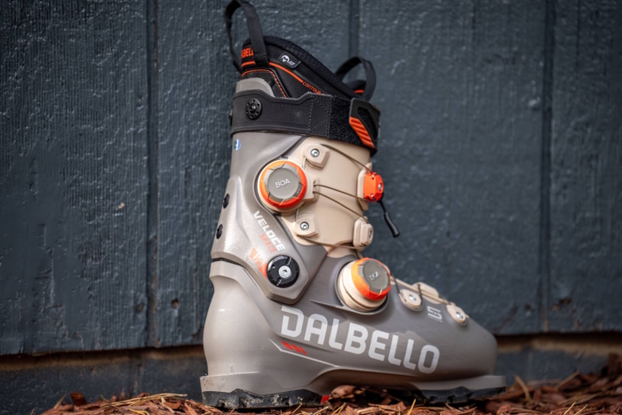 Dalbello Veloce ski boot with dual BOA dials on wood chips.