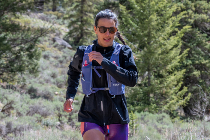 A woman wearing the NathanVaporAiress run vest