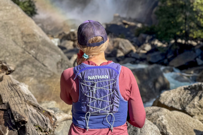 A woman wearing the NathanVaporAiress run vest