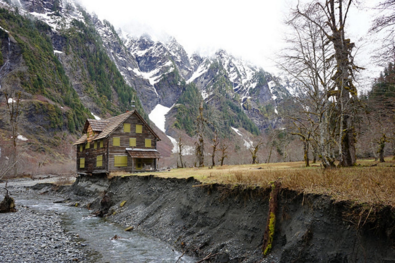 wood log cabin next to river bank in Enchanted Valley