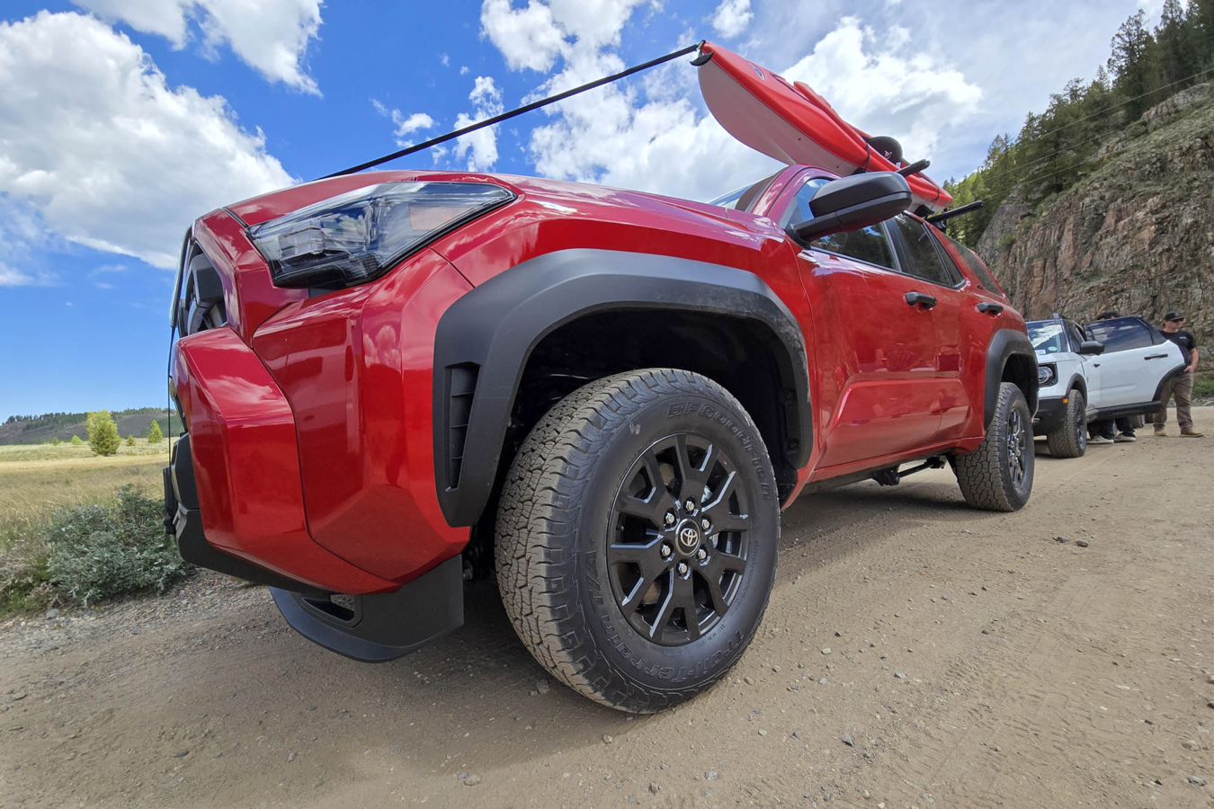 Red Toyota 4Runner with kayaks on the roof and BFGoodrich Trail-Terrain T/A+ tires
