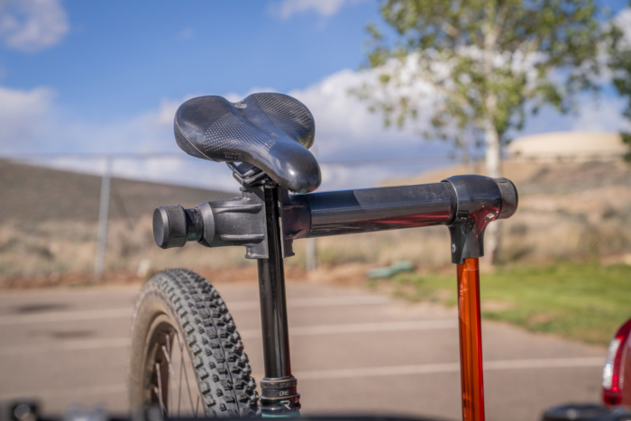 Bike seat clamped in the built in repair stand on a Kuat NV 2.0 rack