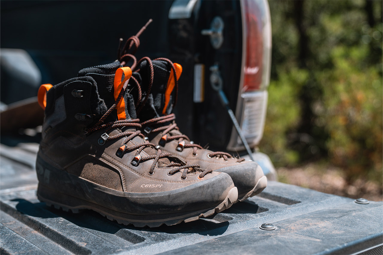 Pair of Crispi Alpine hunting boots sitting on an open truck tailgate