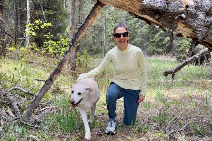 Woman on a hike wearing the TNF Sunriser hoodie