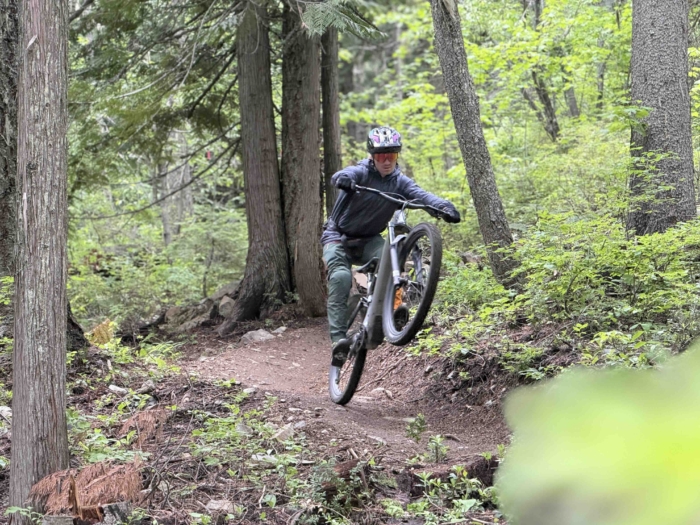 Dane Tudor wheelieing the Specialized Levo 4 EVO Pro