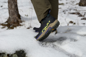 Oboz Katabatic Storm boot stepping through packed snow on a winter hike