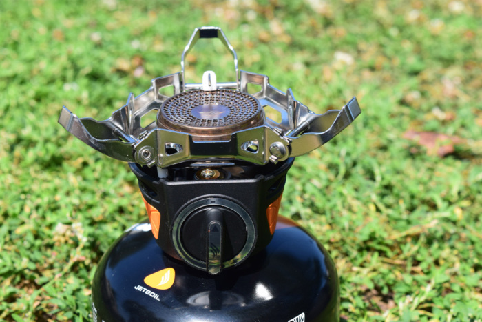 Closeup of the Jetboil burner and pot supports mounted on a fuel canister