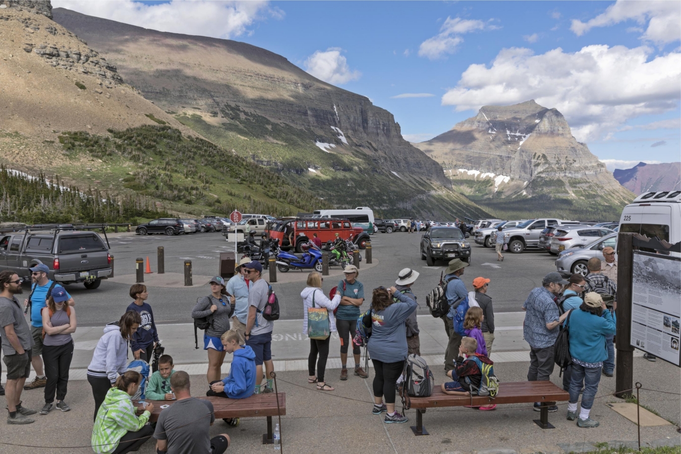people wait in line in parking lot