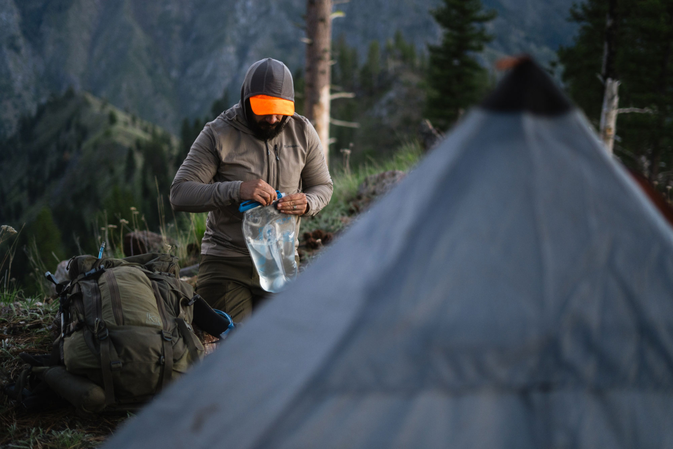 a man camping in the woods