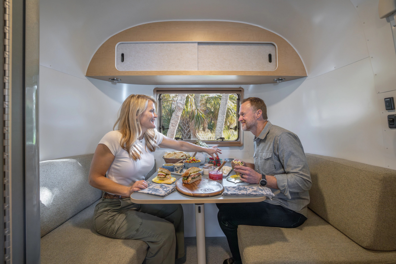 Two people in Airstream World Traveler