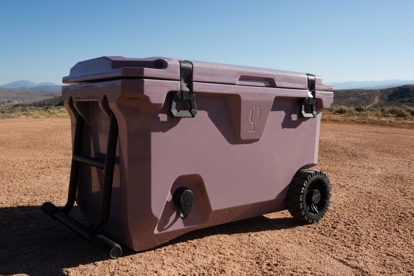 BrüTank 55-Quart Rolling Cooler in the desert environment.