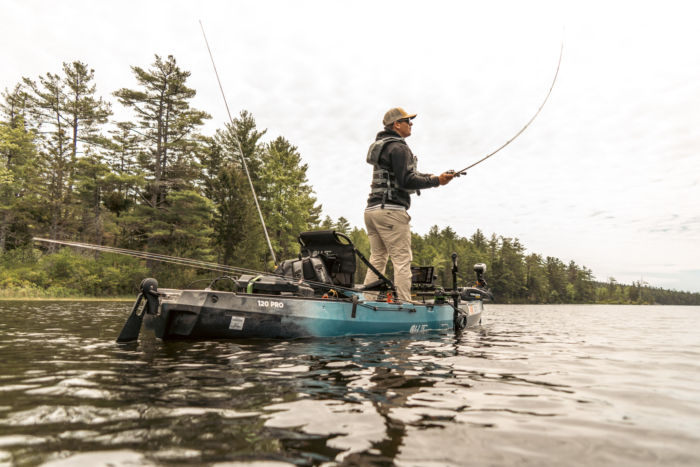 An angler casting from the Old Town Sportsman 120 Pro.