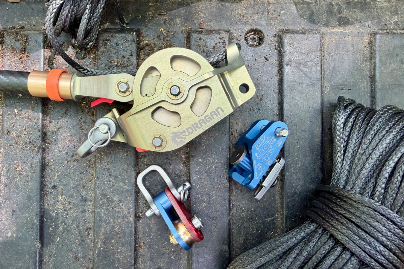 Winch, rope, and hardware laid out on a truck tailgate