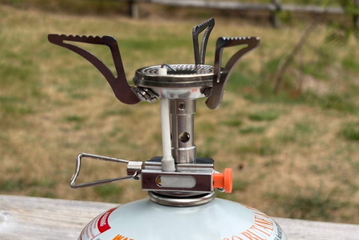 close-up shot of stove hooked up to fuel container