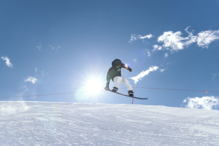 snowboarder getting air and grabbing board