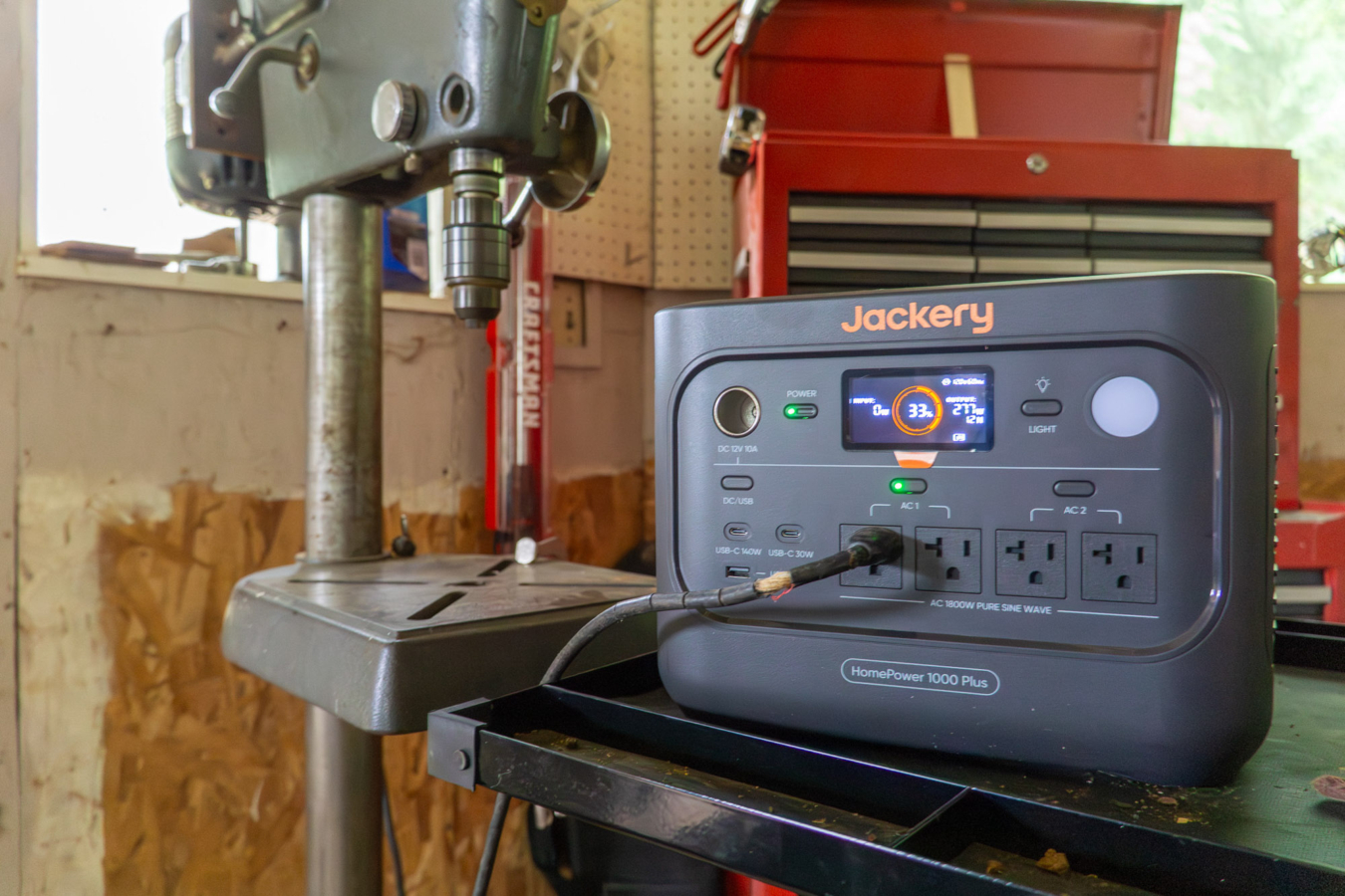 the jackery homepower 1000 v2 on a workbench powering a drill press