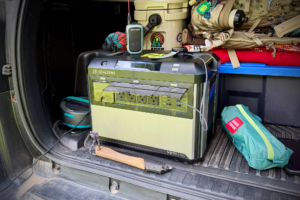 Goal Zero Yeti 1500 portable power station packed with camping gear in the back of a vehicle