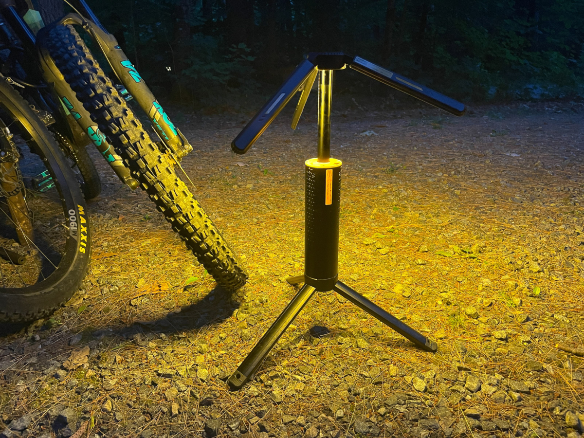 the t1 telescopic lantern illuminating the area beside a mountain bike in the dark