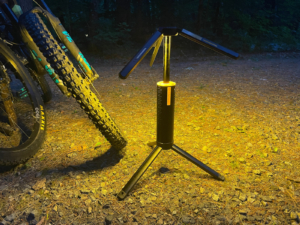 the t1 telescopic lantern illuminating the area beside a mountain bike in the dark