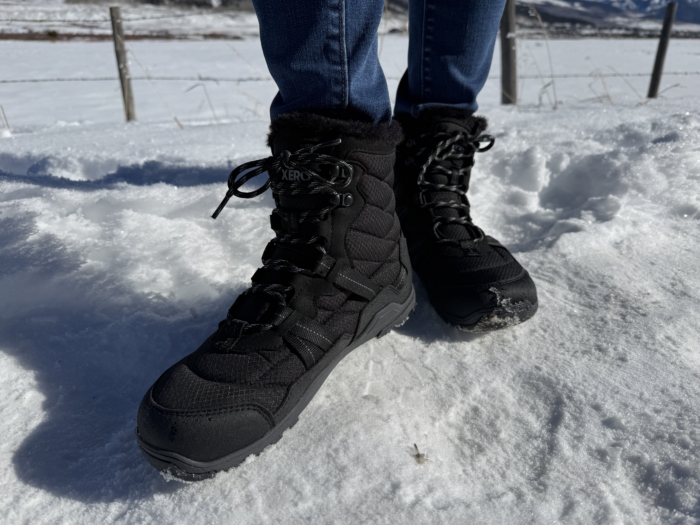 person wearing Xero Shoes Alpine Lace-up on snow
