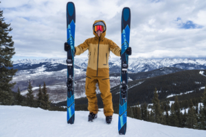 skier holding Kastle Transcend 98 skis
