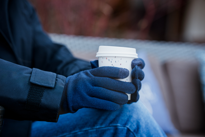 photo of Smartwool Liner Glove around coffee cup