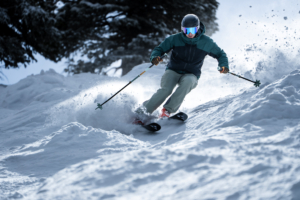 skier descending powdery moguls