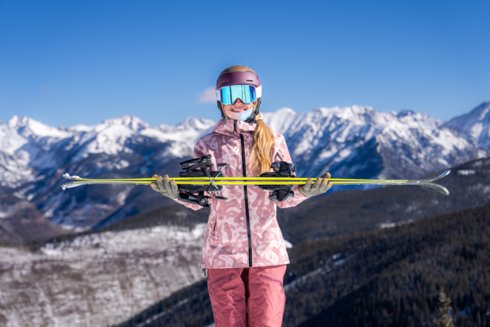 skier holding up ski profile