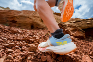Close-up photo of Teva Trailpeak running shoe on redrock terrain