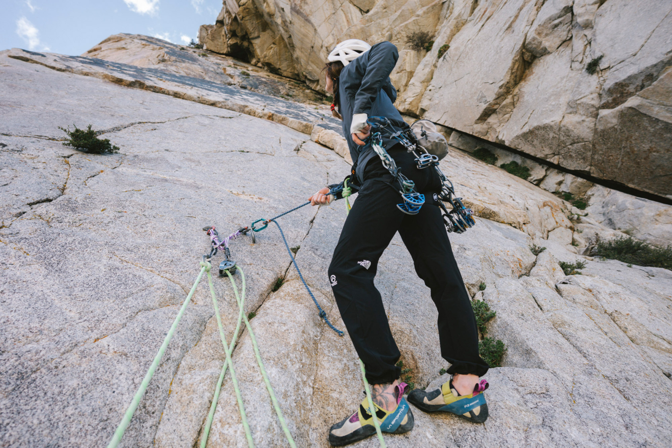 Climber wearing The North Face Off Width Pants on a granite route