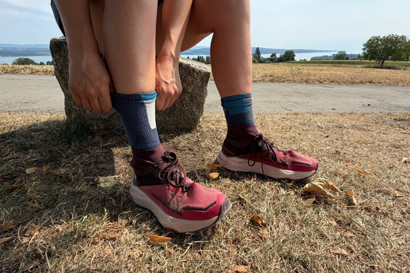 person sitting pulling up socks