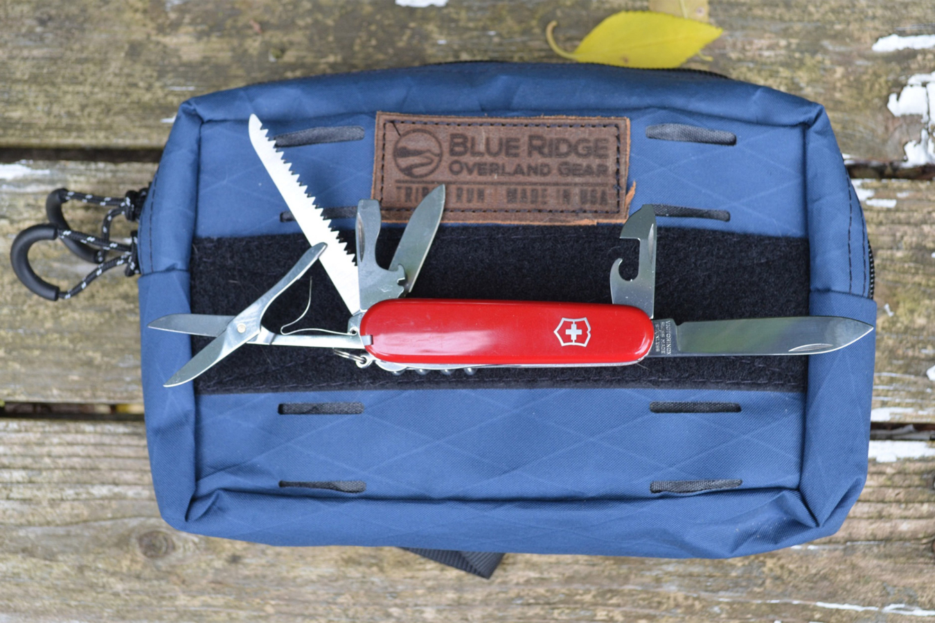 Victorinox Swiss Army Huntsman displaying its blades, saw, scissors, and openers