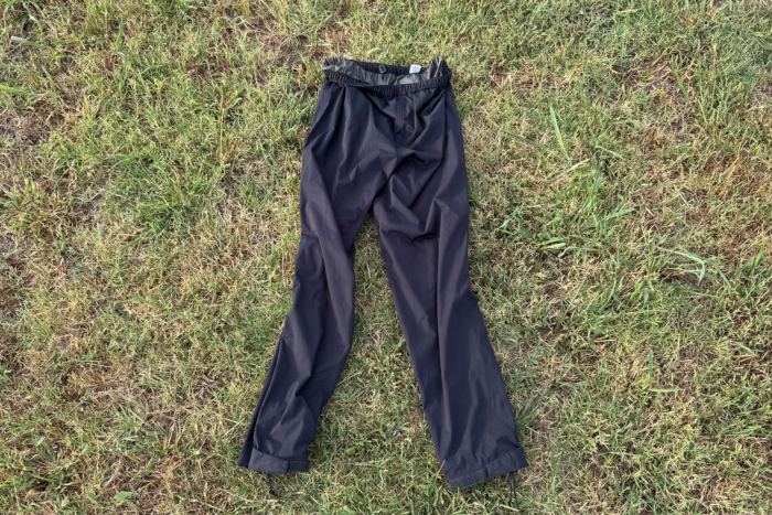 Whitewater Packable Rain Pants laid flat showing the long legs and pocketless design