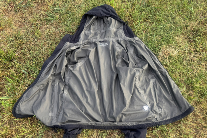 Interior of Whitewater Packable Rain Jacket showing the lining, seams, and hood construction
