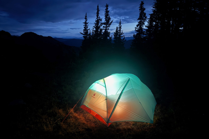 Windquester Horizon Lite tent illuminated from inside at a dark mountain campsite
