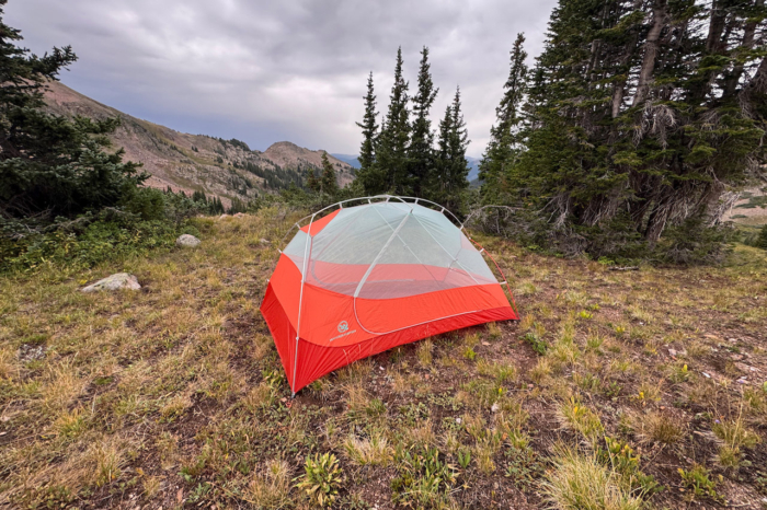 Windquester tent pitched without the rainfly in a mountain clearing