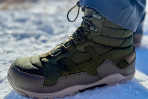 Close-up of a Xero winter boot worn in the snow