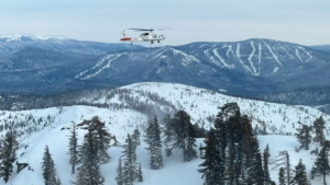 Helicopter over snowy mountains