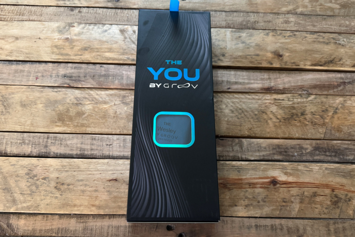Groov Custom Insoles packaging on a wooden table
