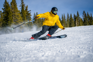 skier carving under blue sky