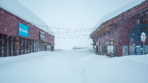 a shopping district at Valle Nevado ski area covered in snow with new snow falling