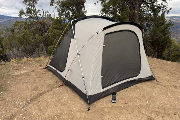Snow Peak tent pitched at a mountain campsite with large mesh doors and windows